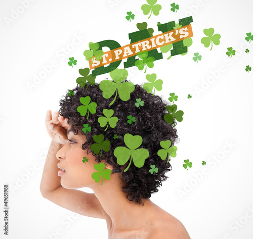 Girl looking into distance with shamrocks coming from her hair