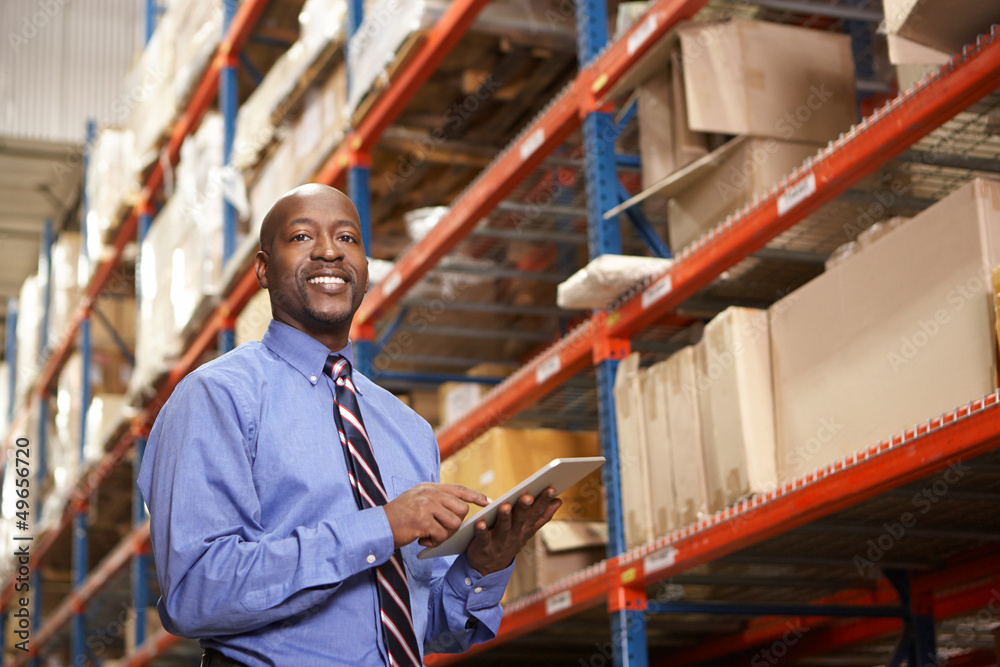 Businessman With Digital Tablet In Warehouse Businessman With Digital Tablet In Warehouse