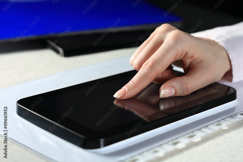 Hand on tablet Hand on tablet