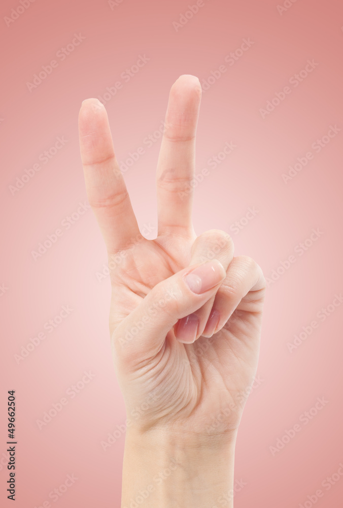 Hand with two fingers up in the peace or victory symbol. Also th Hand with two fingers up in the peace or victory symbol. Also th