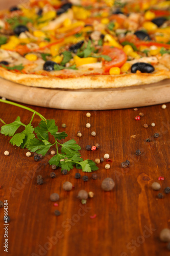 Tasty pizza on wooden table close-up