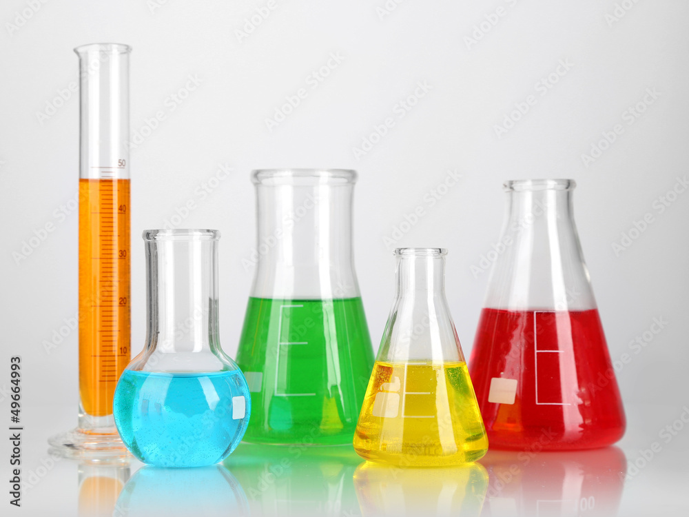 Test tubes with colorful liquids isolated on white Test tubes with colorful liquids isolated on white