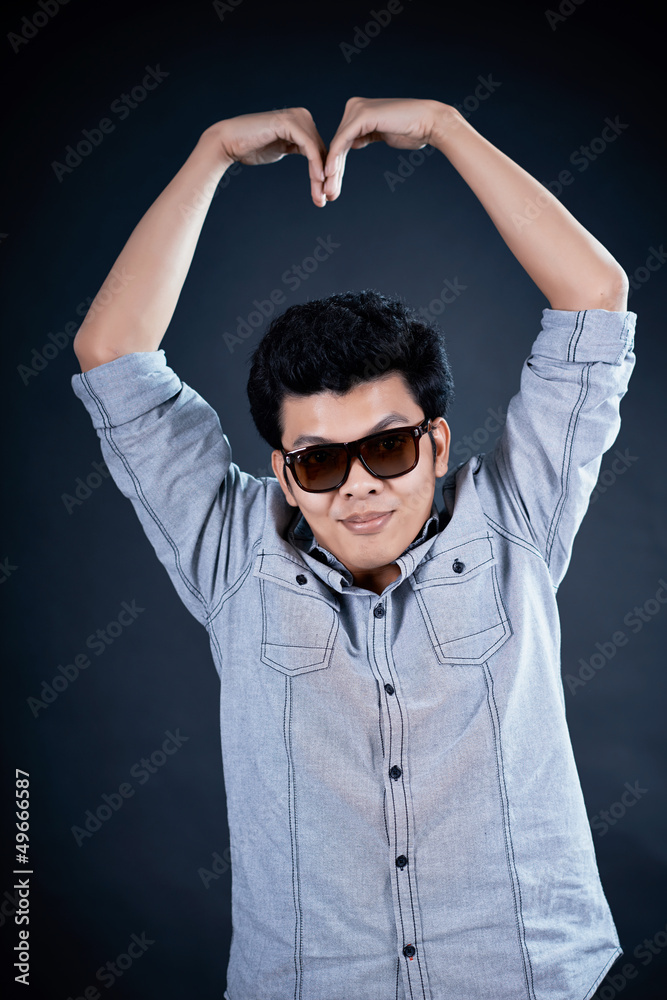 Fototapeta premium love shape hand by Handsome man