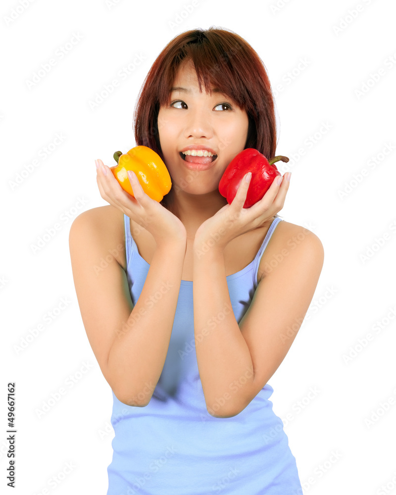Isolated young asian woman with paprika on white Isolated young asian woman with paprika on white