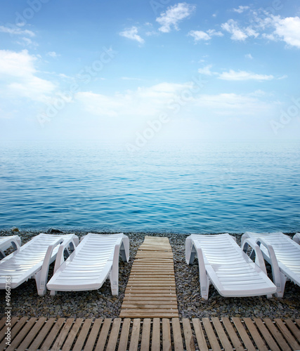 Slika na platnu Beautiful beach with chaise lounge