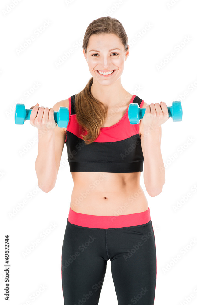 Beautiful young woman working out with dumbbells Beautiful young woman working out with dumbbells