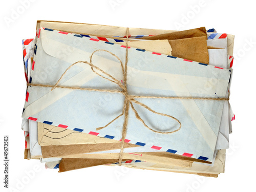 Pile of old envelopes isolated on white background