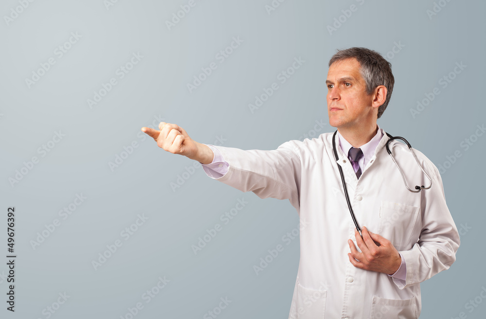 Middle aged doctor gesturing with copy space Middle aged doctor gesturing with copy space