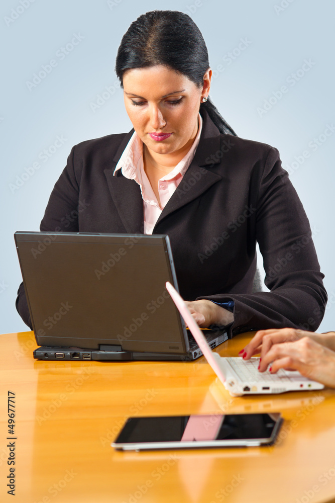 Businesswoman working on her laptop Businesswoman working on her laptop