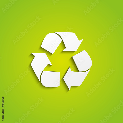 Recycling symbol on green background