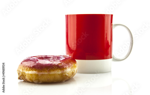 Coffee in red mug with donut