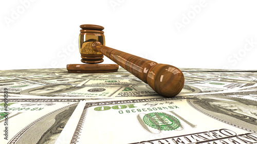 Gavel standing on a dollars