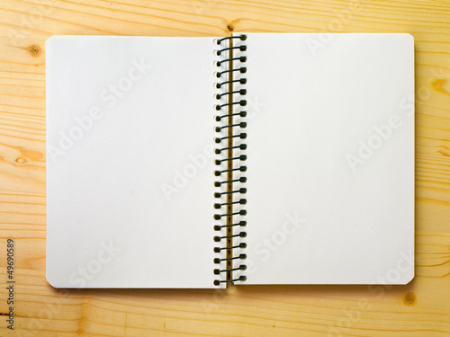 open blank sketchbook on a wood surface