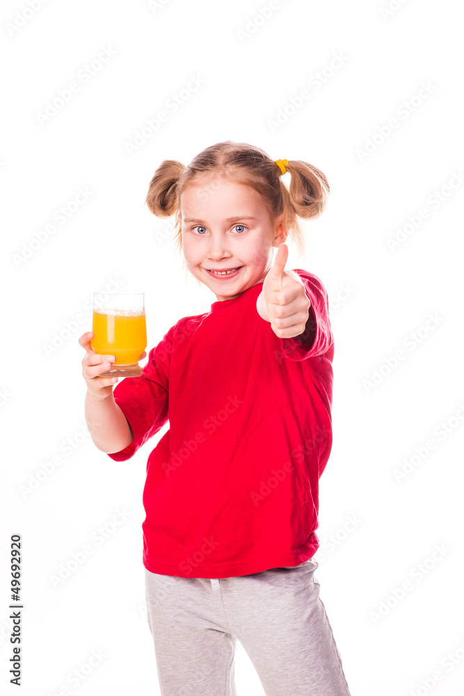 Cute little girl holding glass with juice smiling Cute little girl holding glass with juice smiling