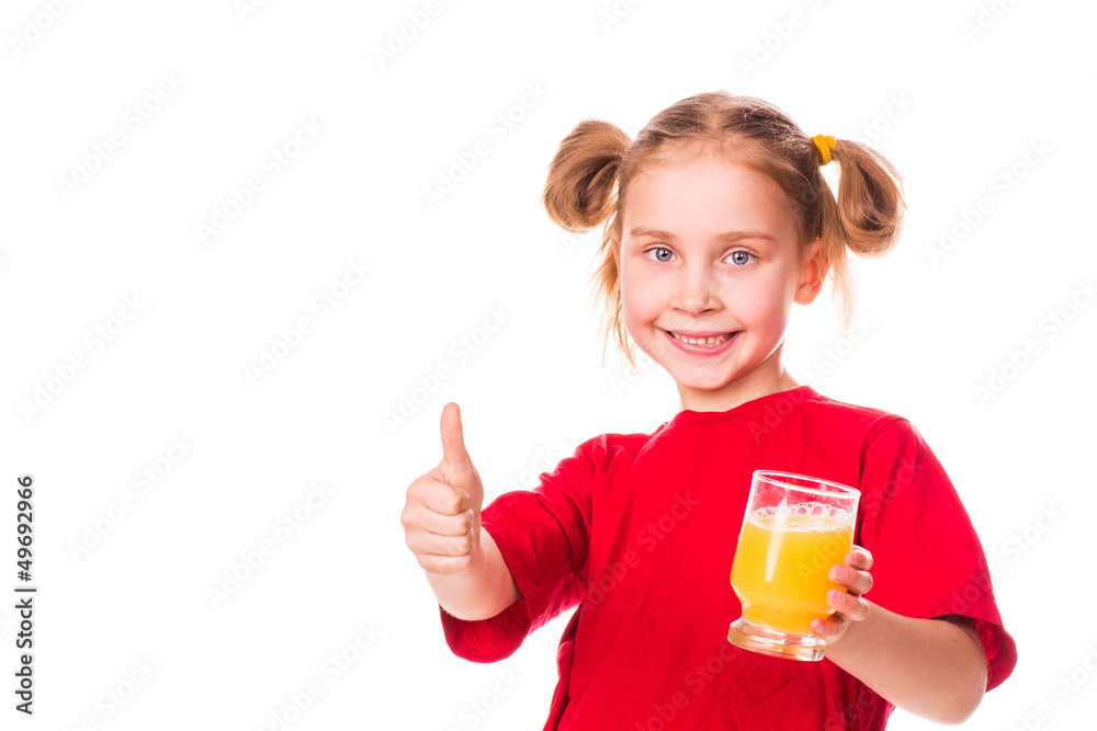 Cute little girl holding glass with juice smiling Cute little girl holding glass with juice smiling