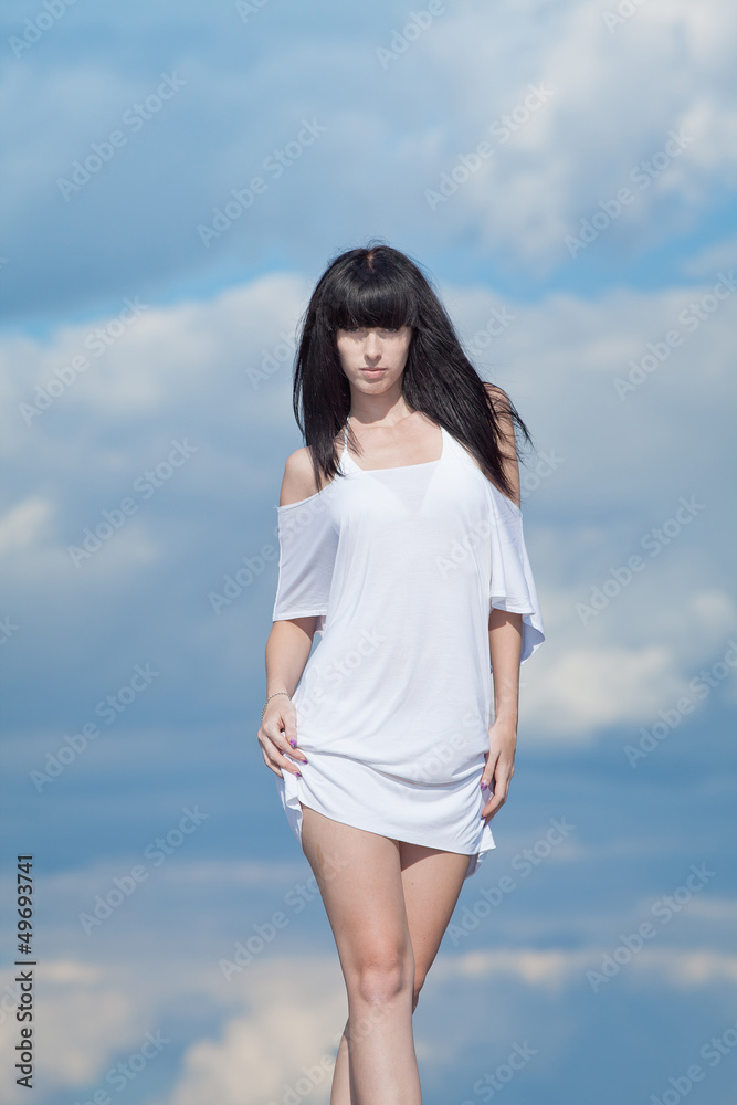 Brunette in white on open air