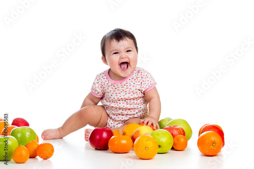 happy baby girl sitting amo...