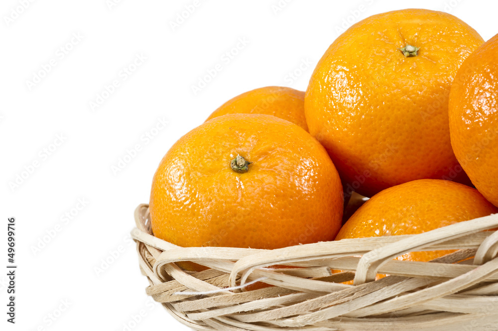Tangerines (mandarin)  in a straw cup