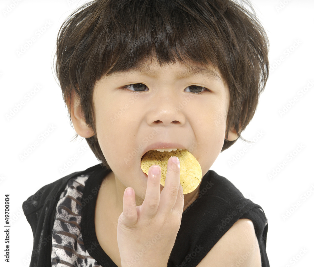 portrait of kid eating a biscuit over white background portrait of kid eating a biscuit over white background