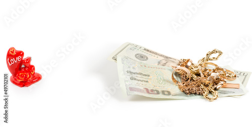 Dollar bills, gold jewellery and love