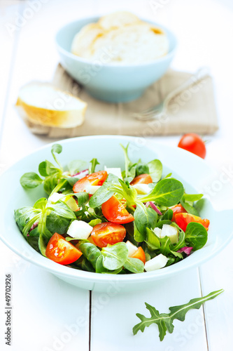 fresh salad with mozzarella, tomatoes and arugula