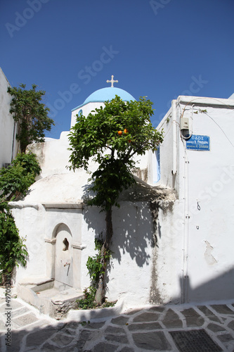 Church and orange tree on Paros island