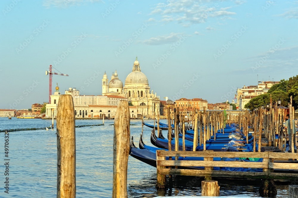 View to the gondolas and boats berth  in Venice.