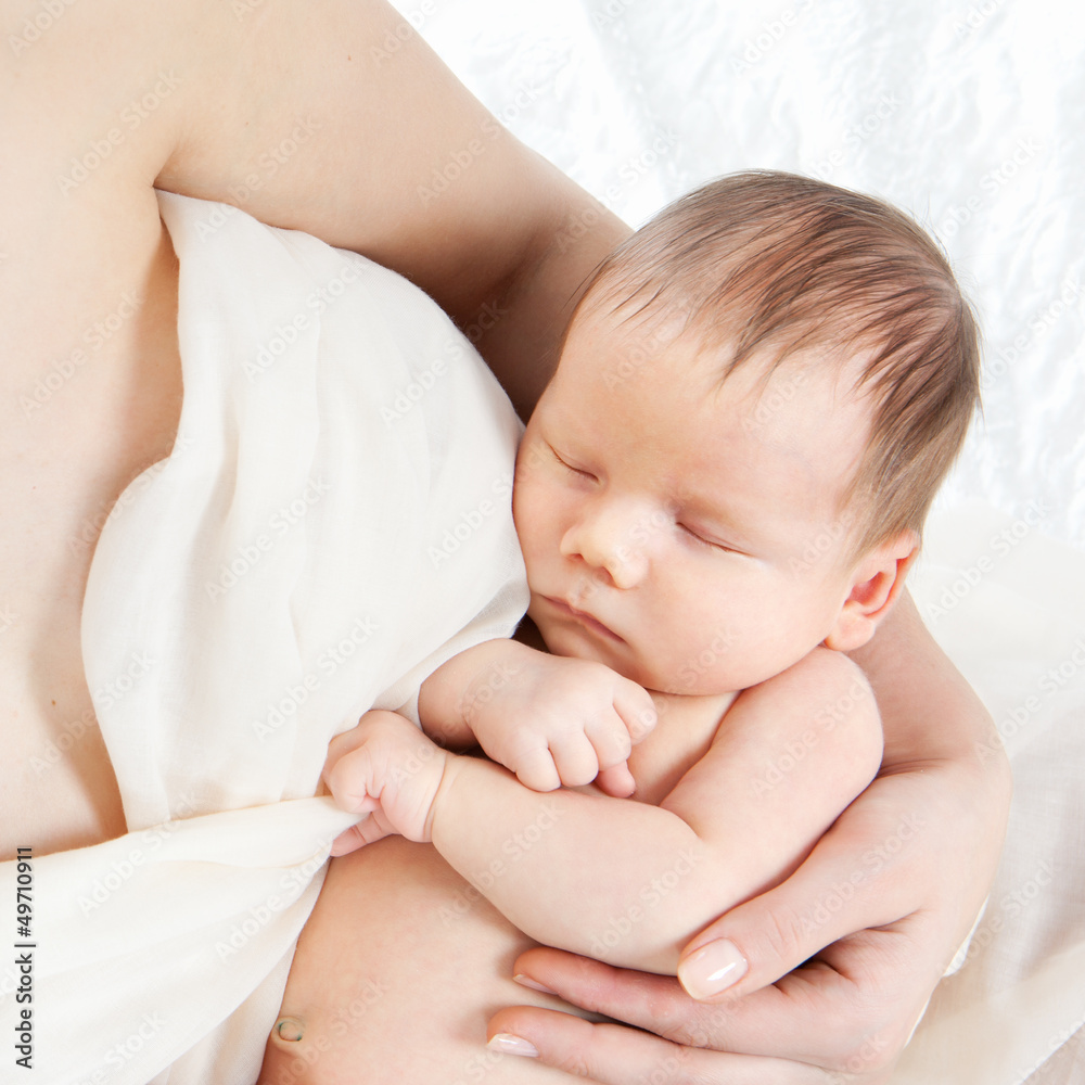 Newborn baby lying on hands of his mother Newborn baby lying on hands of his mother