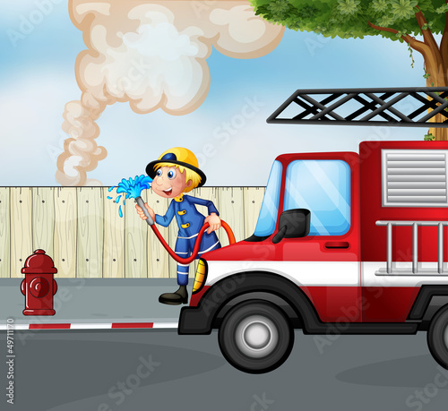 A fireman rescuing a fire near the street