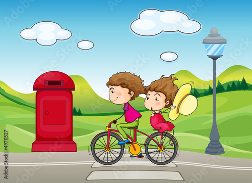 A boy and a girl biking