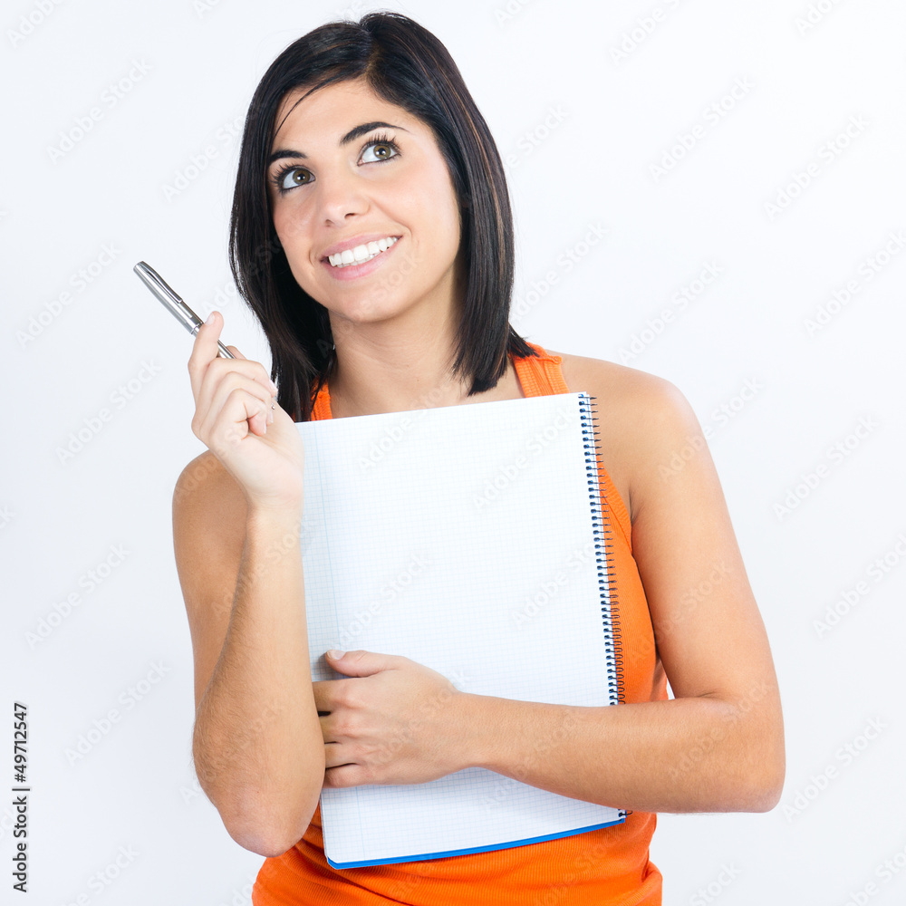 student with notebook planning her daily schedule student with notebook planning her daily schedule