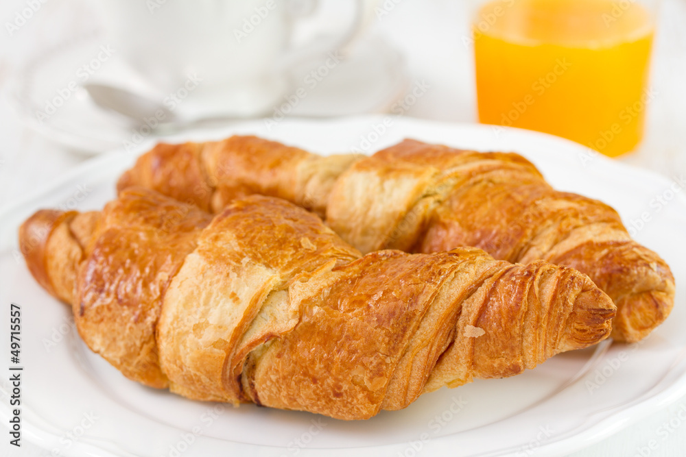 croissant with tea and orange juice