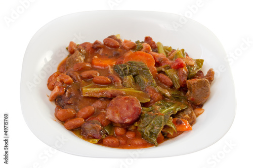 sausages with carrot, beans and cabbage on the plate