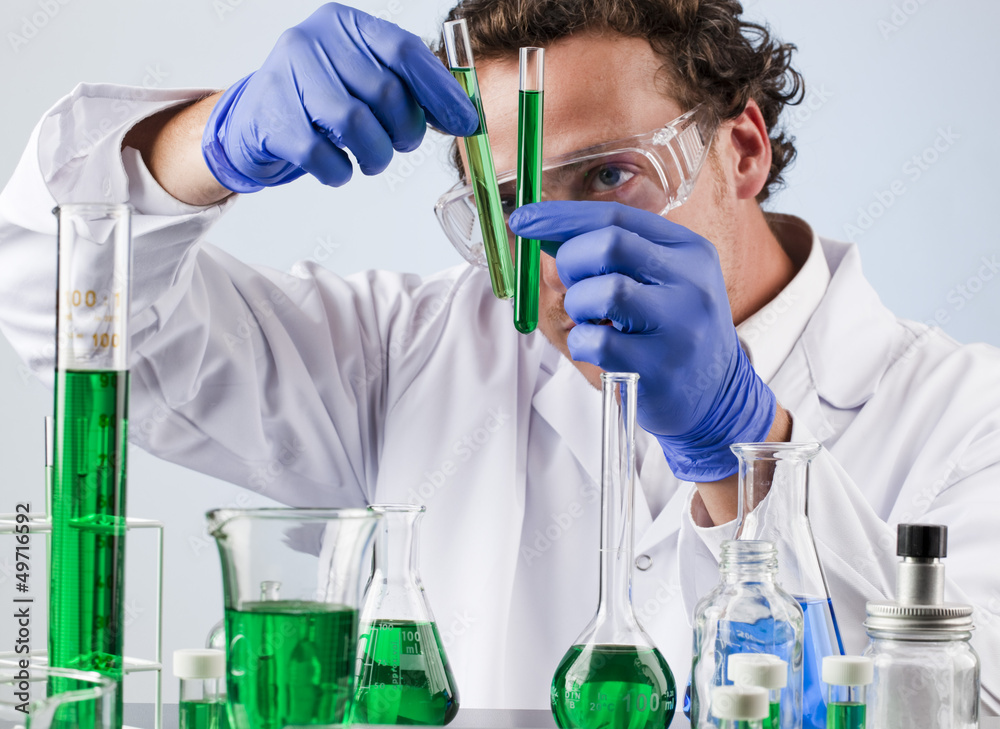 lab expert comparing test tubes lab expert comparing test tubes