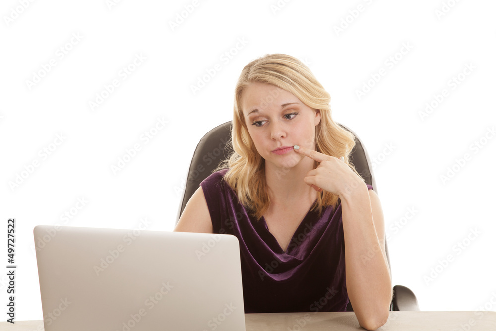 woman computer purple top finger mouth woman computer purple top finger mouth
