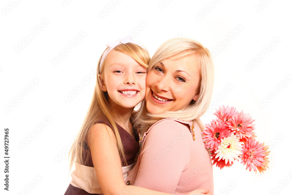 Happy mother and daughter hugging with flowers isolated on white Happy mother and daughter hugging with flowers isolated on white
