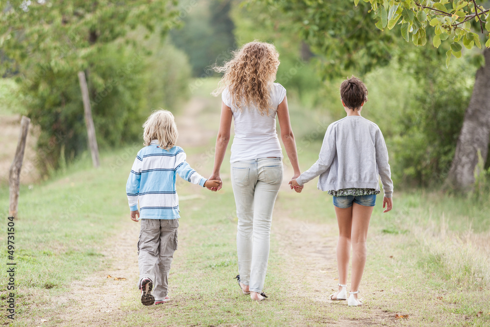Beautiful Young Woman with Two Children Outside Beautiful Young Woman with Two Children Outside