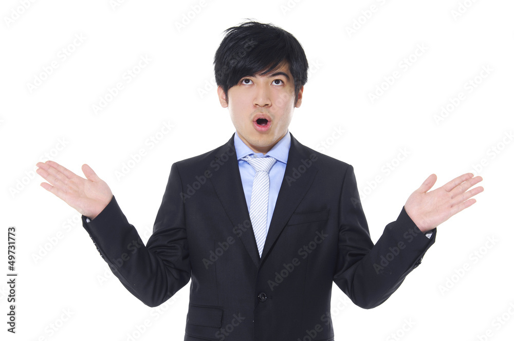 Young businessman lifting arms in excitement Young businessman lifting arms in excitement