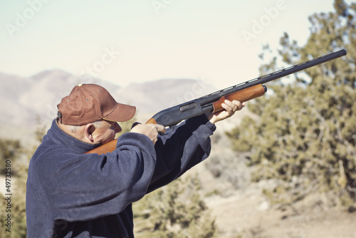 Man Shooting a Shotgun Hunting