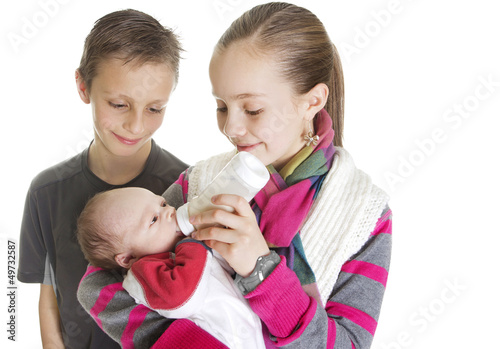фотографія Siblings Caring for their new Baby Brother