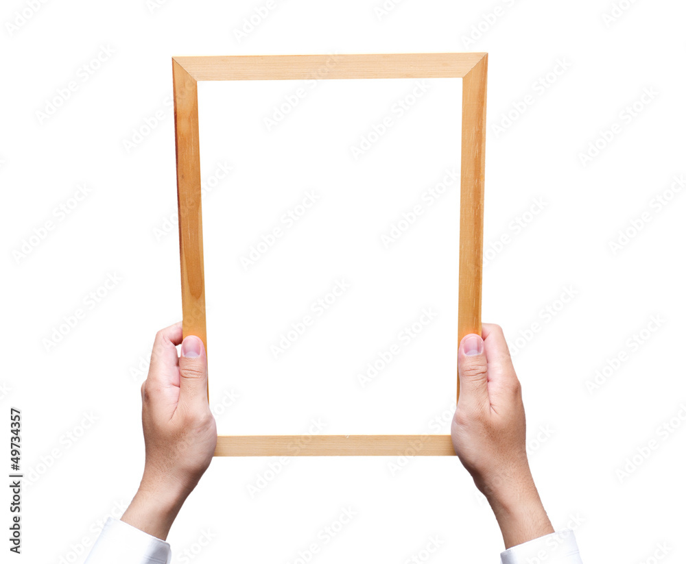 Hand holding wooden frame isolated on white Hand holding wooden frame isolated on white