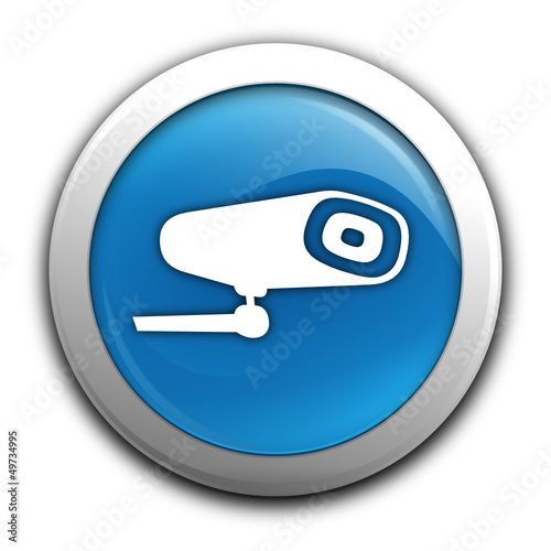 caméra sur bouton bleu