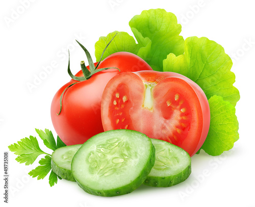 Isolated vegetables. Fresh cut tomato, cucumber and lettuce (salad ingredients) isolated on white background photo