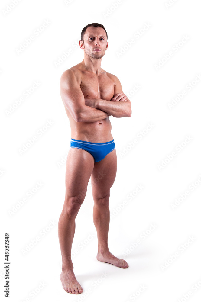 Young man wearing swimsuit isolated over white background. 