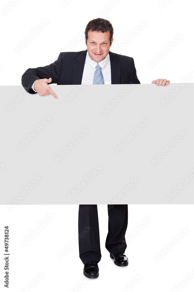 Successful businessman presenting empty banner Successful businessman presenting empty banner