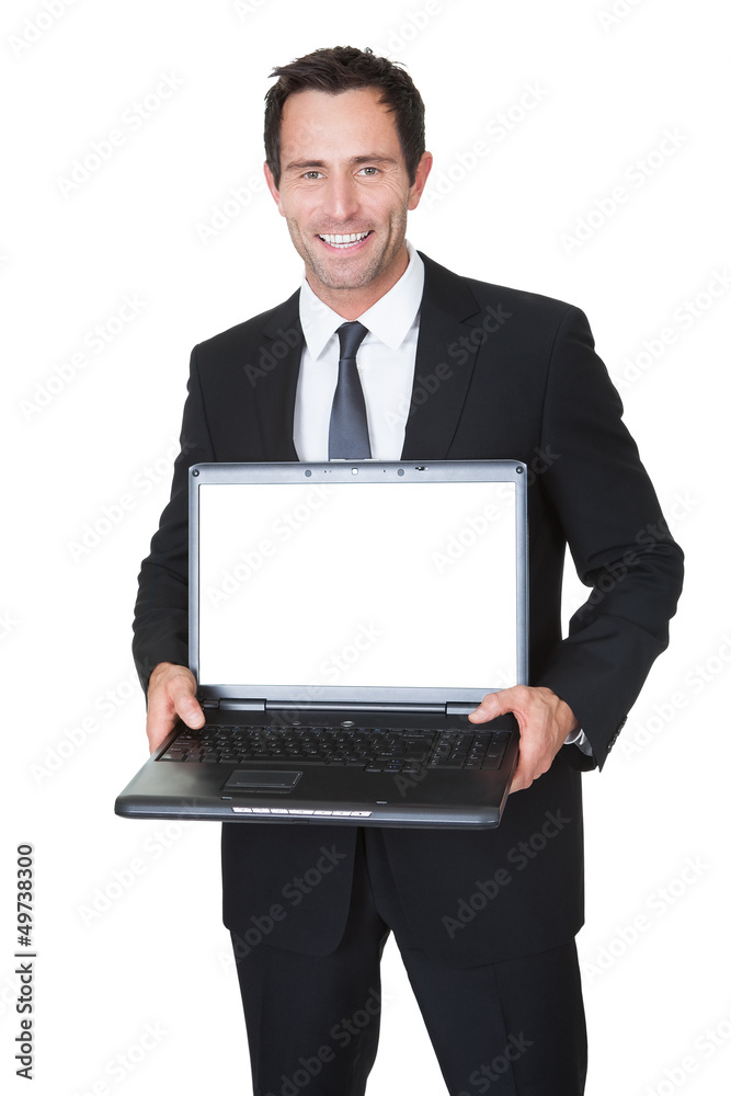 Happy middle aged businessman with laptop Happy middle aged businessman with laptop