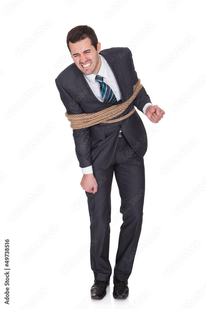 Businessman tied up in rope Businessman tied up in rope