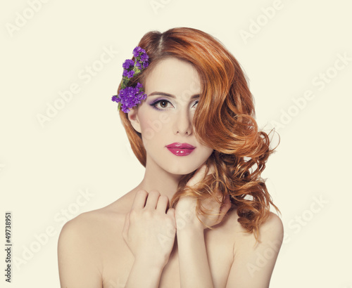 Redhead girl with flower, isolated.