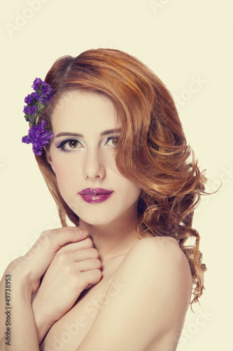 Redhead girl with flower  isolated.
