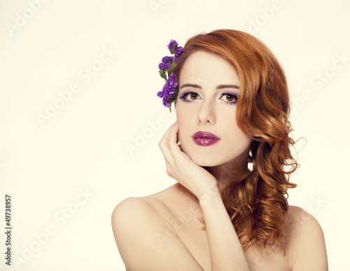 Redhead girl with flower  isolated.